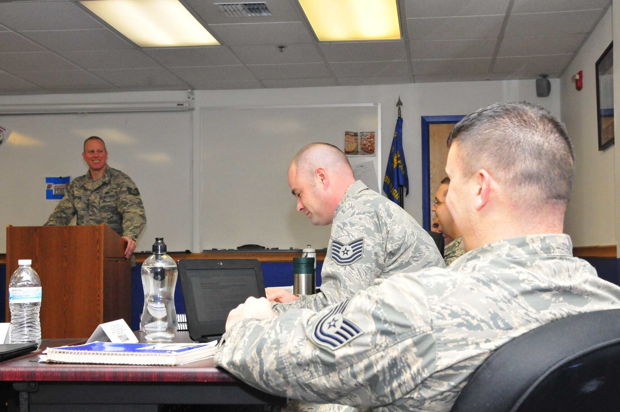 Tech. Sgt. Jarod Cappon, Elmendorf Professional Military Education Center instructor, guides a discussion with students during NCO Academy Class 14-1 Dec. 10, 2013, Eielson Air Force Base, Alaska. Cappon is deployed to Eielson from Joint Base Elmendorf-Richardson, Alaska to teach the in-resident PME course as a cost saving initiative for the Air Force. (U.S. Air Force photo by Master Sgt. Jason Vaught/Released)