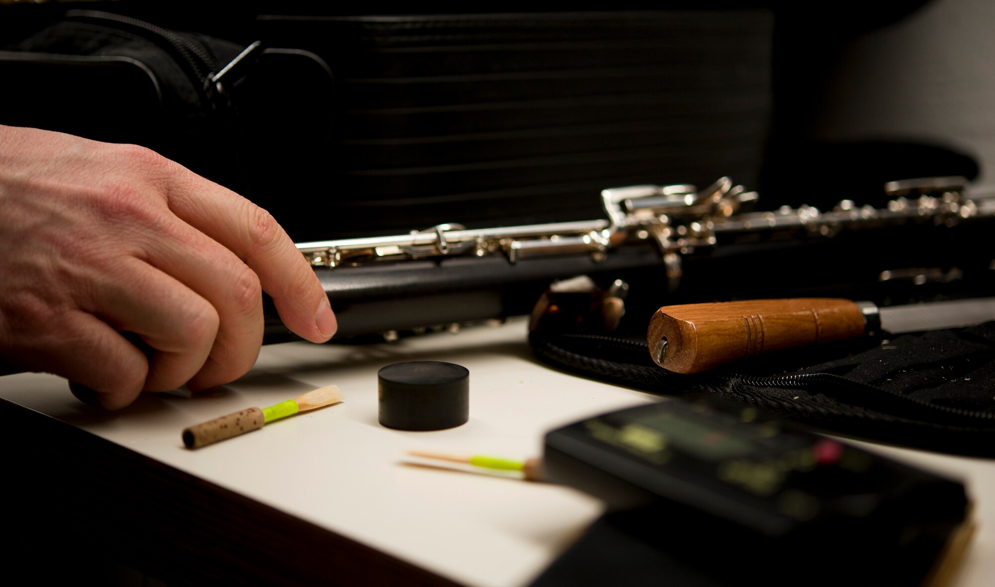 Staff Sgt. Justin Hummer, USAFE Band oboe player, prepares his instrument for the KMC Holiday Concert, Dec. 13, 2013. The concert is an annual tradition for the USAFE Band and is open to the public. (U.S. Air Force photo/Senior Airman Damon Kasberg)