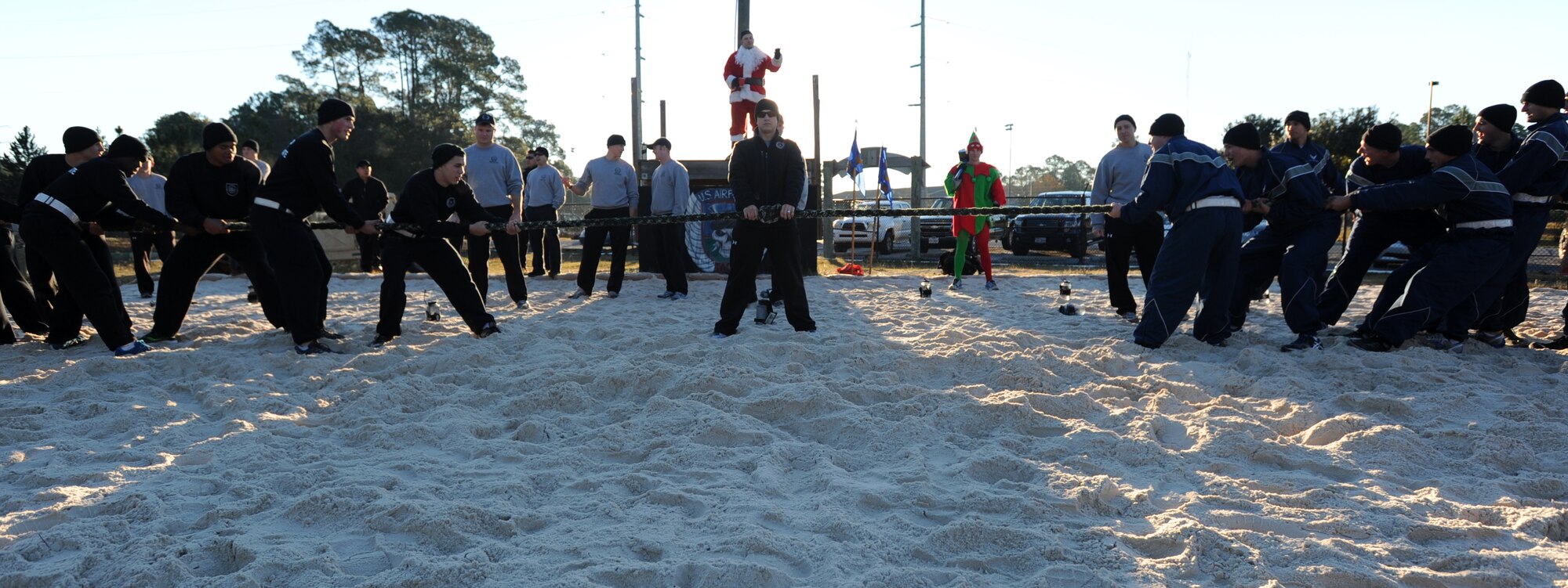 Tactical Air Control Party candidates begin a tug-of-war showdown during their annual holiday physical training session on Hurlburt Field, Fla., Dec. 18, 2013. Students and instructors participated in the event. (U.S. Air Force photo/Senior Airman Kentavist P. Brackin) 