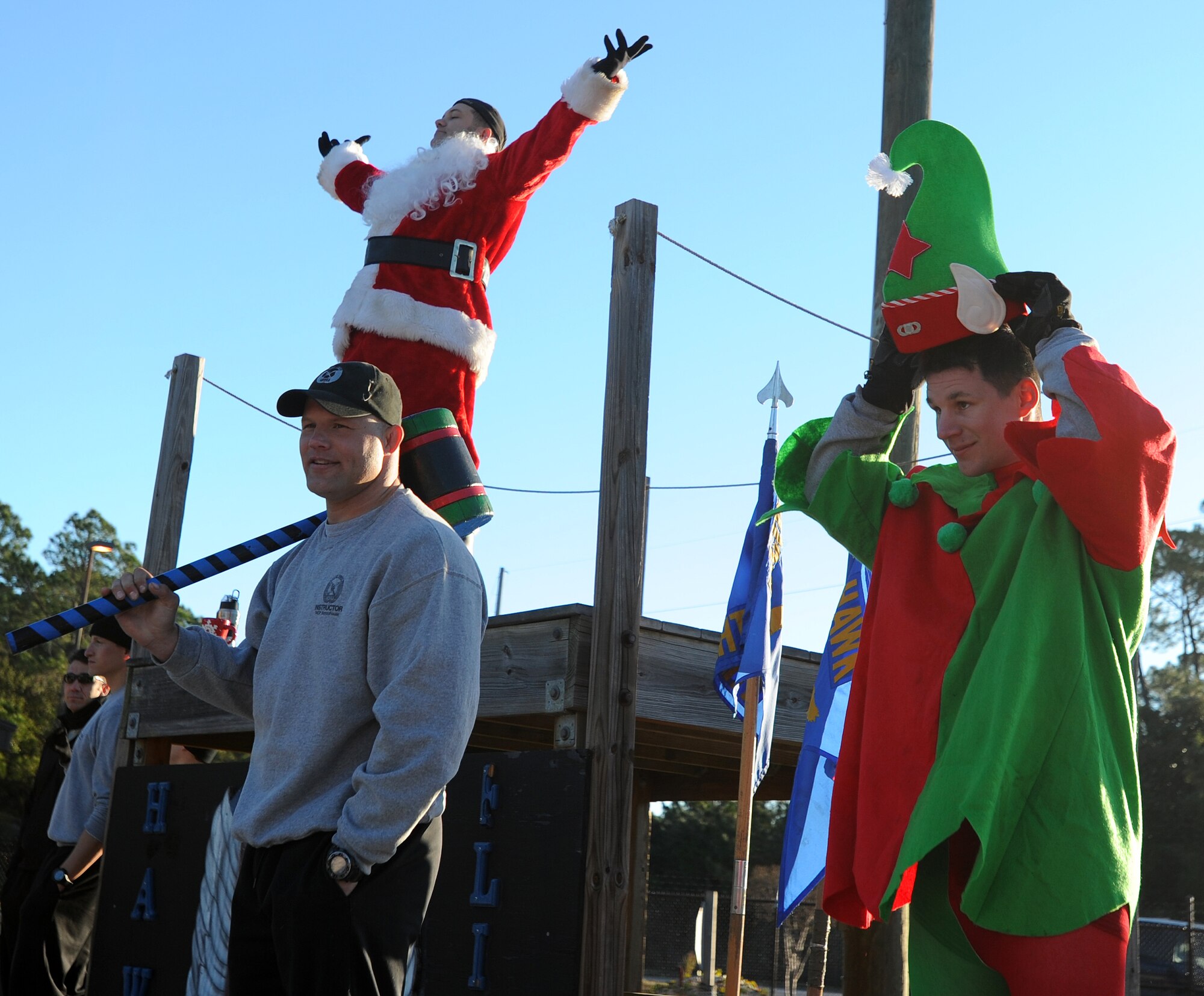 Tactical Air Control Party instructors watch as their Airmen participate in their annual holiday physical training session on Hurlburt Field, Fla., Dec. 18, 2013. More than 100 Airmen from the 342nd Training Squadron participated in the festivities. (U.S. Air Force photo/Senior Airman Kentavist P. Brackin) 