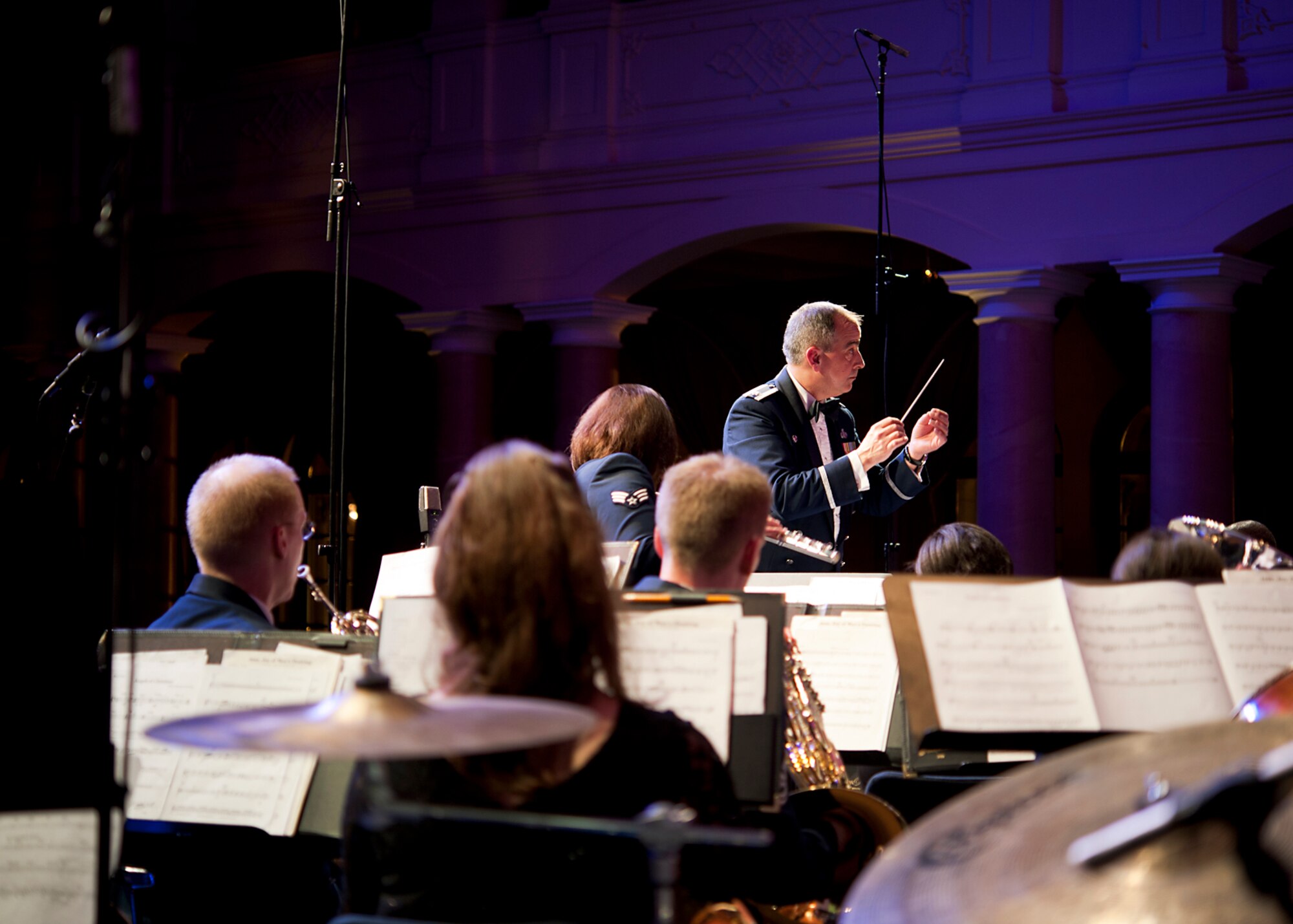 Lt. Col. R. Michael Mench, USAFE Band conductor, leads members of the band through the holiday lineup during the KMC Holiday Concert, Dec. 13, 2013. The concert is an annual tradition for the USAFE Band and is open to the public. (U.S. Air Force photo/Senior Airman Damon Kasberg) 