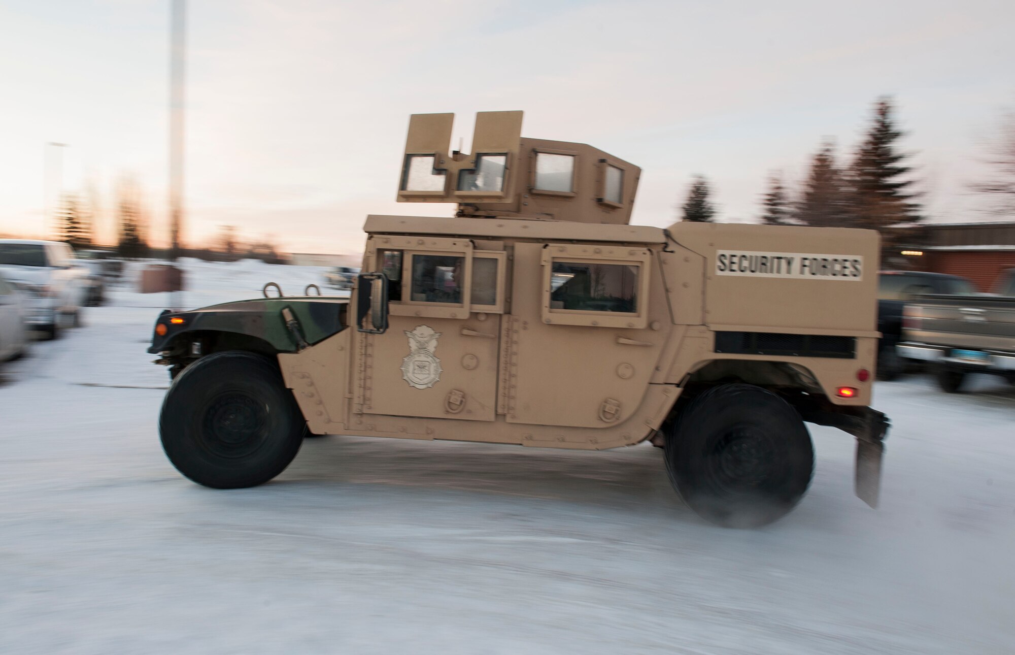 An up-armored Humvee from the 791st Missile Security Forces Squadron departs for the missile complex from Minot Air Force Base, N.D. Dec. 11. The 91st MSFS Airmen are typically deployed to the missile complex for four days at a time on a rotational basis. (U.S. Air Force photo/Senior Airman Stephanie Sauberan)