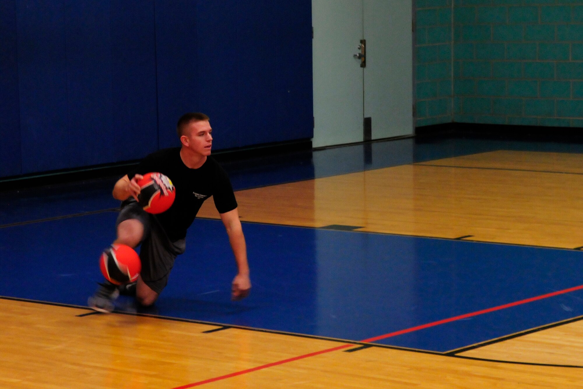 GOODFELLOW AIR FORCE BASE, Texas – Airman 1st Class Chayce Verity, 312th Training Squadron student, catches a dodge ball at Mathis Fitness Center Dec. 14. Airmen from the 312th Training Squadron defeated soldiers from the 344th Military Intelligence Battalion during Deck the Halls with Dodgeballs tournament, a friendly camaraderie building event among sister services.  (U.S. Air Force photo/ Airman 1st Class Devin Boyer)
