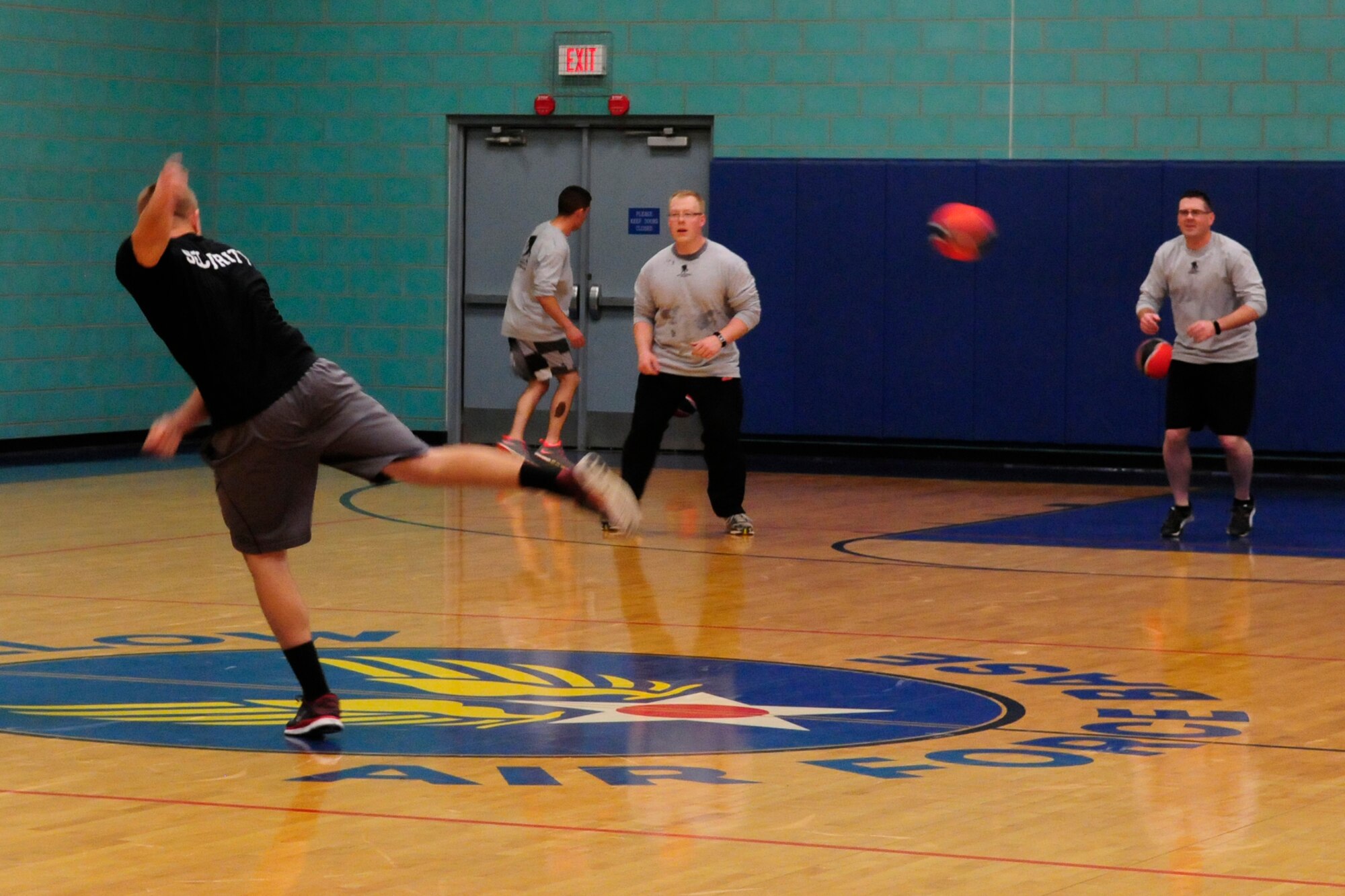 GOODFELLOW AIR FORCE BASE, Texas – Airman 1st Class Chayce Verity, 312th Training Squadron student, throws a dodge ball at Army 344th Military Intelligence Battalion competitors at Mathis Fitness Center Dec. 14.  In Goodfellow’s joint service environment, events like this Deck the Halls with Dodgeballs tournament help to build camaraderie among the sister services.  (U.S. Air Force photo/ Airman 1st Class Devin Boyer)