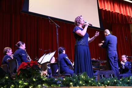 Air Force Master Sgt. Nancy Poffenbarger, vocalist for the Air Force Band of the West, performs during the Holiday in Blue concert Dec. 17 at the Joint Base San Antonio-Lackland Bob Hope Theater. The concert included a variety of holiday songs, a children’s story and a sing-a-long. The band provides hundreds of performances to military and civilian audiences throughout the year. (U.S. Air Force photo by Airman 1st Class Lincoln Korver)