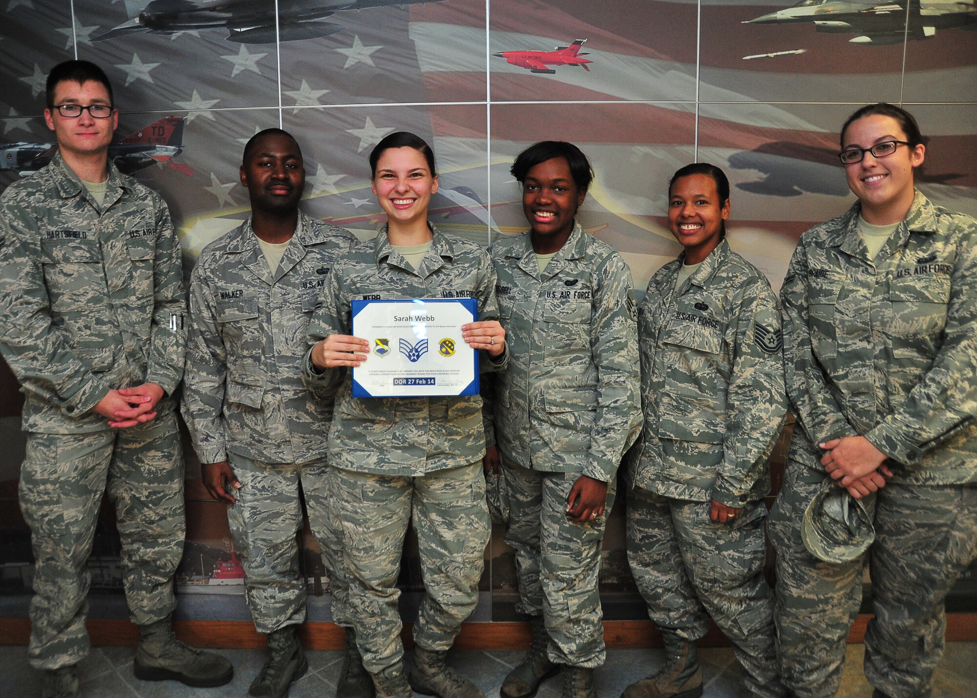 Airman 1st Class Sarah Webb, Communications Squadron official mail technician, received Senior Airman below-the-zone Dec. 13, at the 53rd Weapons Evaluations Group auditorium. BTZ is a program which allows airmen 1st class to promote to senior airman six months prior to the normal promotion rate. (U.S. Air Force photo by Airman 1st Class Sergio A. Gamboa)