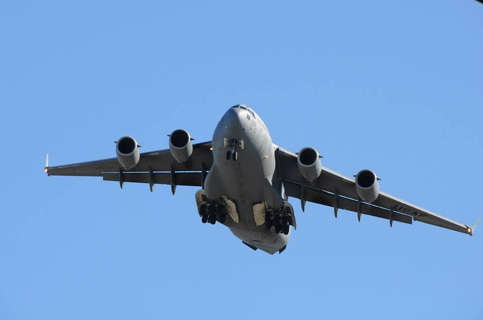 The "The Spirit of Charleston" performs a low-level flyover of the flight line after the jet passed the 20,000 flight hours mark this week.  (U.S. Air Force Reserve photo by Michael Dukes)
