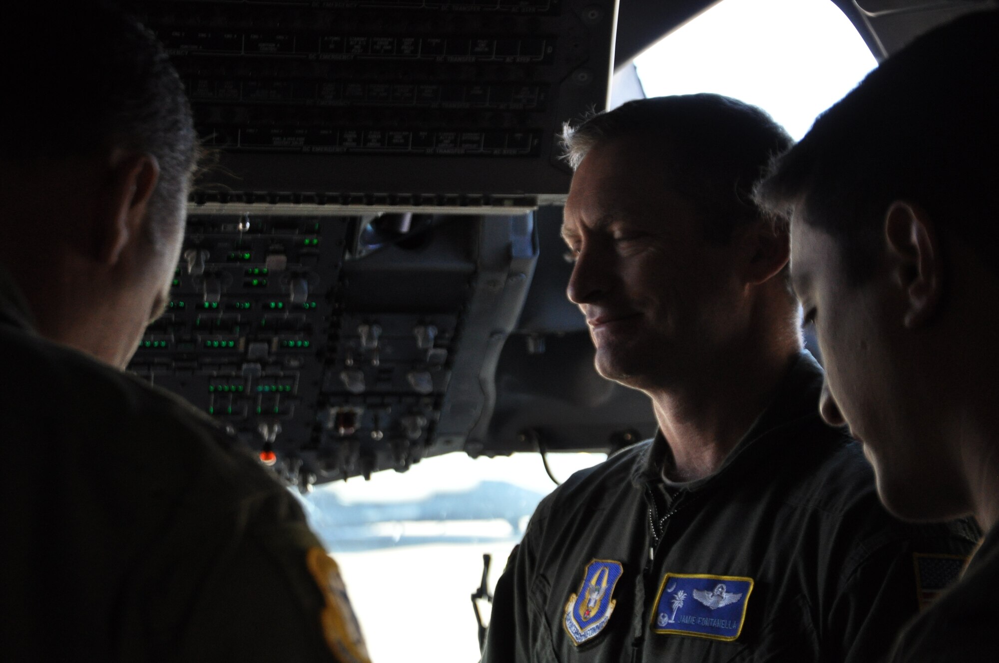Col. James Fontanella, 315th Airlift Wing commander, chats with Col. Darren Hartford, 437th AW commander on the flight deck of "The Spirit of Charleston"  tail 1192 before flying the jet to surpass its 20,000 flight hours this week.  (U.S. Air Force Reserve photo by Senior Airman Meredith Thomas)