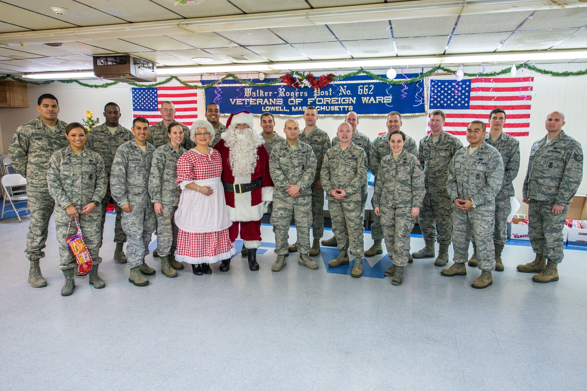 Lowell, Mass. -- Airmen pose for a group photo after serving meals to veterans at the Lowell VFW holiday party Dec. 18. The Hanscom Air Force Sergeants Association supported the Air Force Association sponsored event with volunteers. (U.S. Air Force photo by Rick Berry)