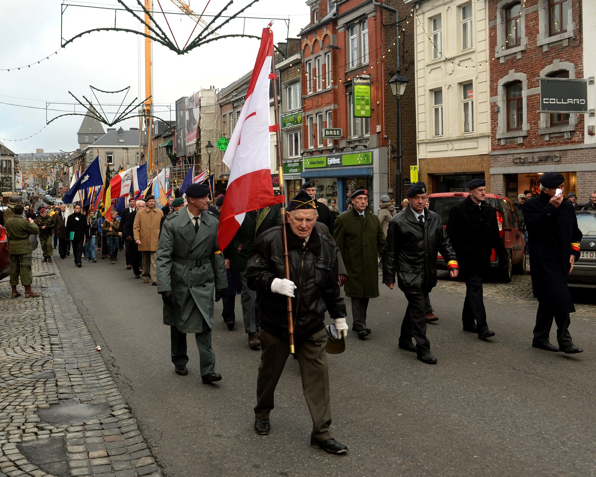 BASTOGNE, Belgium -- A veteran walks in a parade during the 36th Bastogne Historic Walk Dec. 14, 2013. For the parade, participants marched through the town all the way to the memorials of American Generals Patton and McAuliffe. (U.S. Air Force photo by Senior Airman Rusty Frank/Released)