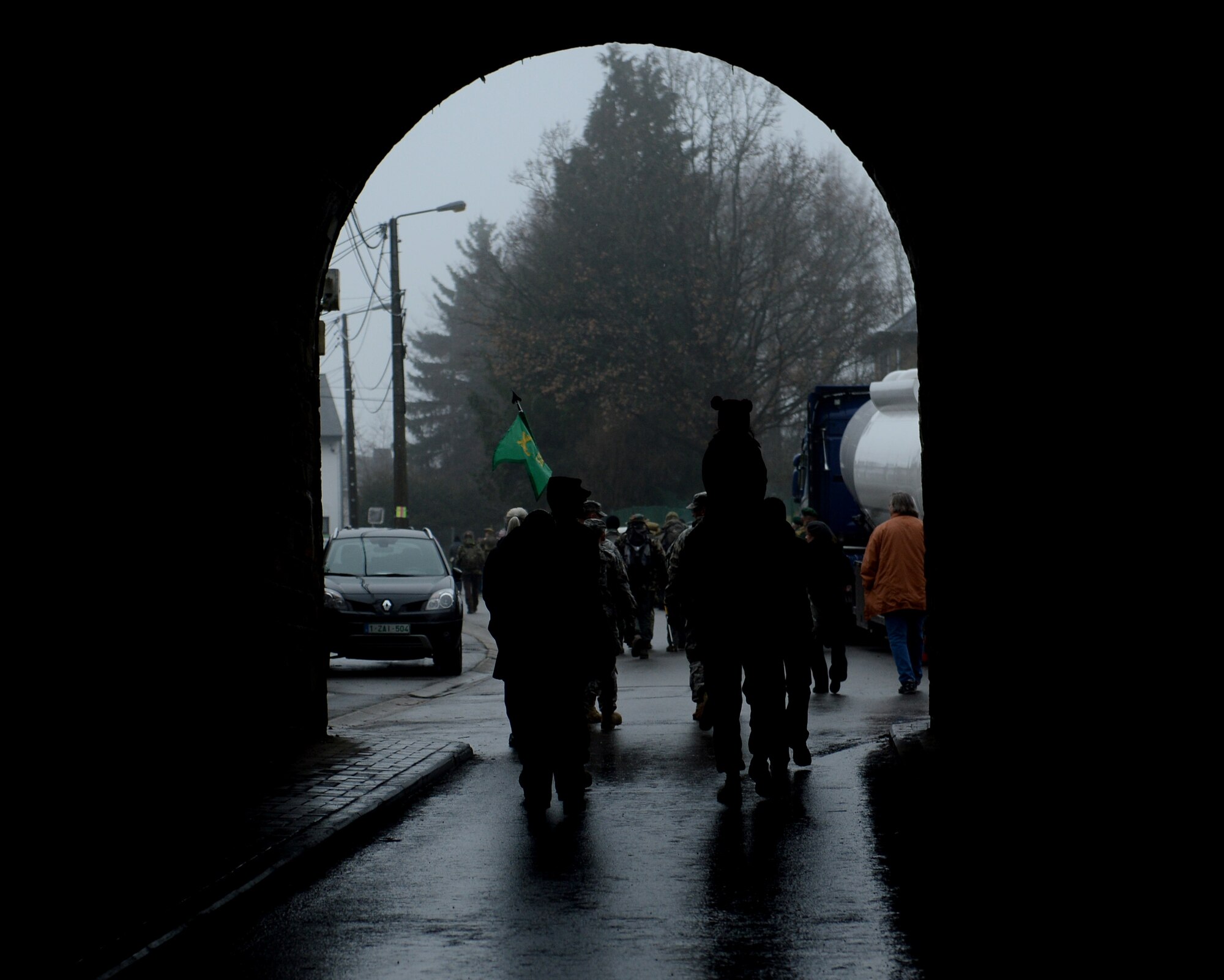 BASTOGNE, Belgium  -- Participants in the 36th Bastogne Historic Walk march under a bridge Dec. 14 2013. Event organizers conducted the walk to remember those who paid the ultimate sacrifice during the siege of Bastogne and the Battle of the Bulge in World War II. (U.S. Air Force photo by Senior Airman Rusty Frank/Released)