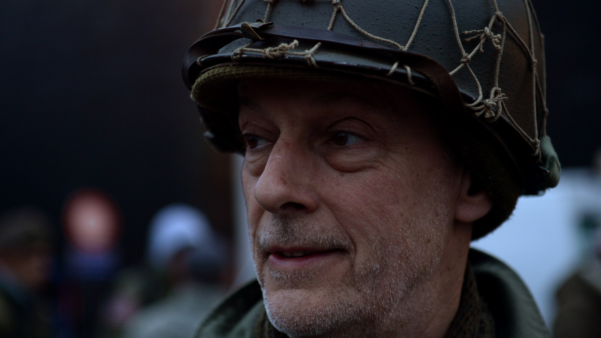 BASTOGNE, Belgium -- A World War II reenactor looks at a crowd gathering prior to the beginning of the 36th Bastogne Historic Walk Dec. 14, 2013. For the walk, participants dressed up in period clothes from World War II. (U.S. Air Force photo by Senior Airman Rusty Frank/Released)