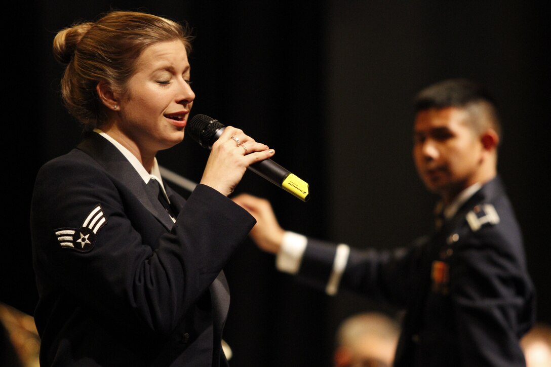 The USAFE Concert Band performs a holiday program for the community of Kelkheim, Germany.  SrA Carmen Emborski (featured) sings "Elohai N'tzor" a Jewish prayer.