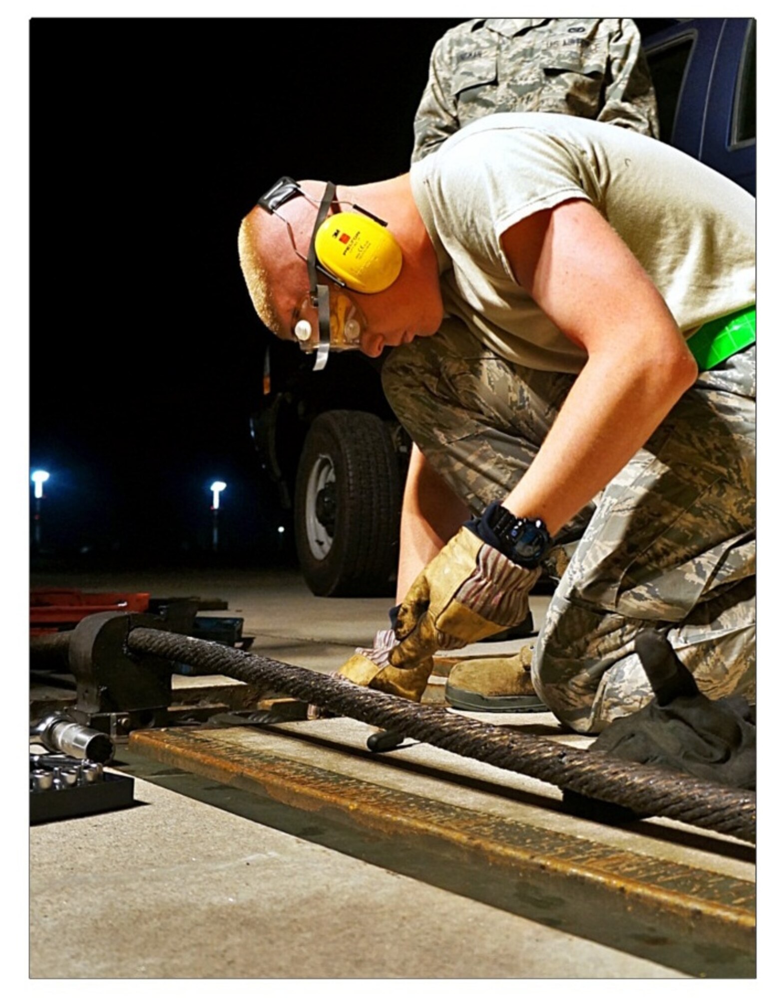 Airman 1st Class Jonathon Moore, 786th CES electrical power production technician, replaces the cams and torsion springs in the BAK 14 support box, Ramstein Air Base, Germany, Dec. 01, 2013. This project was important because many of the parts only have a certain time that they can be in operation before they have to be tested and replaced to ensure the systems in-flight emergencies can be safely grounded, saving a pilots life and billions of dollars' worth of aircraft.  (courtesy photo)