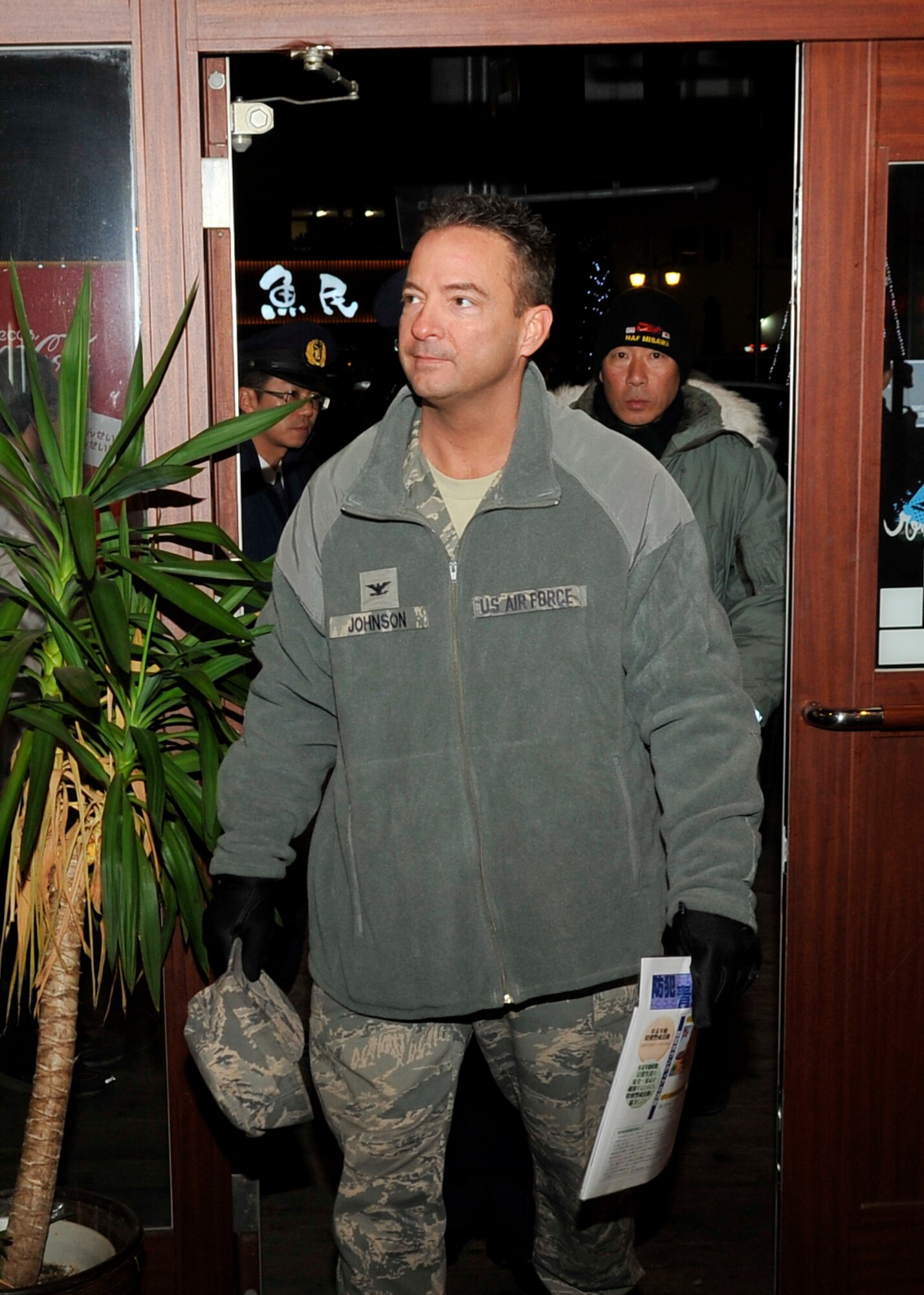 U.S. Air Force Col. Danny Johnson, 35th Mission Group commander, participates in a joint-bilateral town patrol outside of Misawa Air Base, Japan, Dec. 17, 2013. Base leadership met with owners of local establishments as a part of Misawa’s annual Safety and Crime Prevention Campaign. (U.S. Air Force photo by Airman 1st Class Zachary Kee)