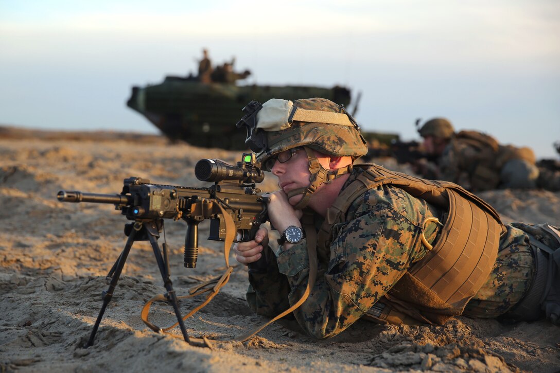 Marine Corps Lance Cpl. Shawn Allen provides security with his M16 rifle on Red Beach during an amphibious landing exercise in support of Exercise Steel Knight 2014 on Marine Corps Base Camp Pendleton, Calif., Dec. 9, 2013. Allen, a rifleman, is assigned to 2nd Battalion, 1st Marine Regiment.