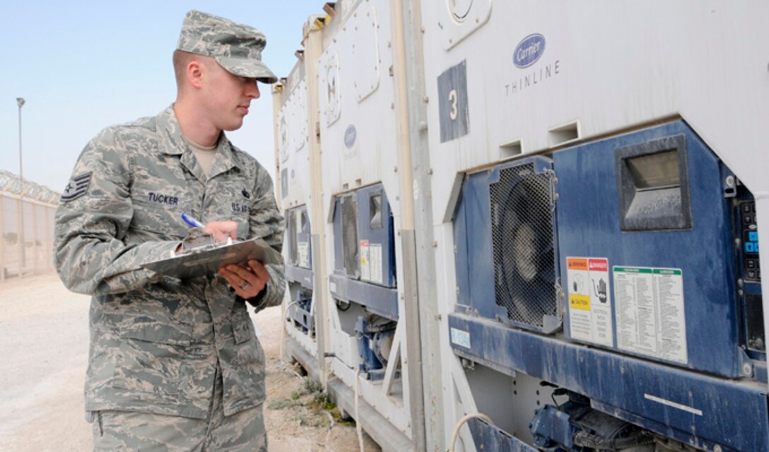 Staff Sgt. Jesse Tucker checks the temperature of a connex freezer at the 379th Air Expeditionary Wing in Southwest Asia, Dec. 17, 2013. The connex freezer is used to keep food products at the appropriate temperature and prevent it from s. Tucker is a 379th Expeditionary Force Support Squadron member deployed from Hurlburt Field, Fla., and a Navarre, Fla., native. (U.S. Air Force photo/Senior Airman Hannah Landeros)