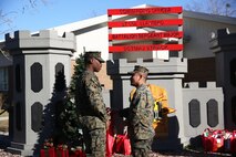 Marines with 8th Engineer Support Battalion, 2nd Marine Logistics Group embrace the generous spirit of Christmas, lending a hand to their fellow service members.  Lt. Col. Ferdinand F. Llantero, the commanding officer of 8th ESB, presented an assortment of Christmas gifts to selected service members in front of the 8th ESB castle, here, Dec. 19. Service members with children were selected by their peers and chain of command to receive the gifts, which they can give to their children on Christmas.