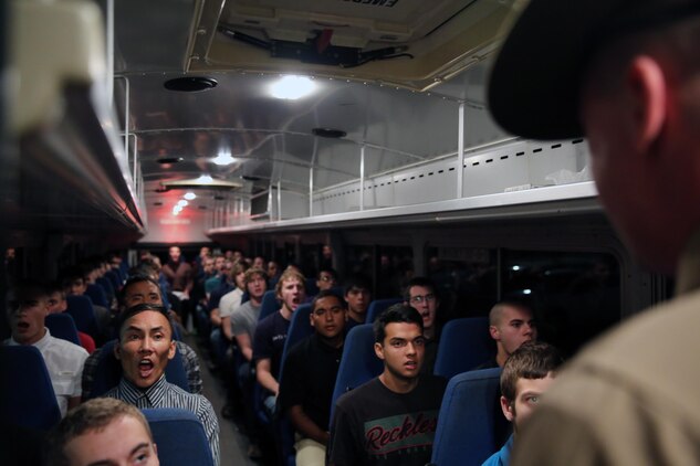 Recruits of Company B, 1st Recruit Training Battalion, receive their initial orders from the receiving drill instructor aboard the depot, Dec. 2. This is the first interaction recruits receive with drill instructors.
	
