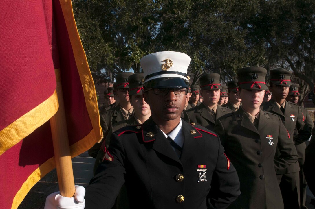 PARRIS ISLAND, S.C. - Pfc. Lauren B. Albury, honor graduate for platoon 4042, stands at parade rest before graduation here, Dec. 20, 2013. Albury, a native of West Palm Beach, Fla. was recruited by Sgt. Kenneth L. Gutierrez, a recruiter from Recruiting Station Fort Lauderdale. Albury will be able to enjoy some much deserved leave with her family as she prepares for Marine combat training in Camp Geiger, N.C. (U.S. Marine Corps photo by Lance Cpl. Stanley Cao)