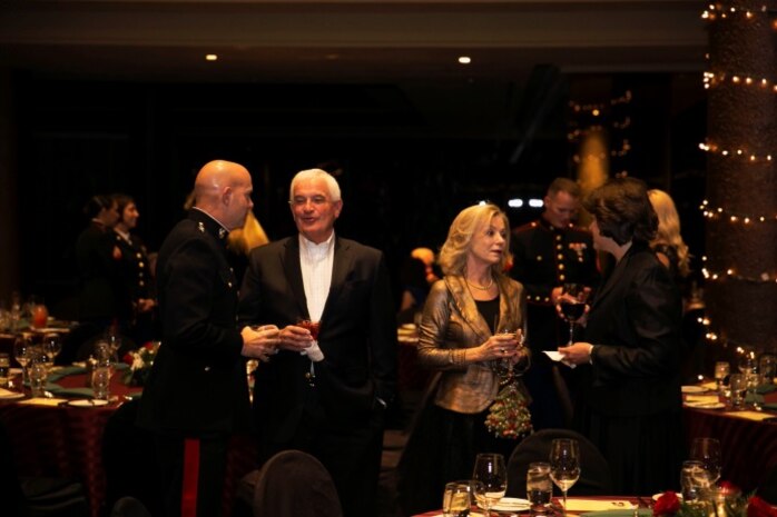 Maj. Gen. David H. Berger, Combat Center Commanding General, talks with Professional Golfers’ Association West club members during a Toys for Tots dinner at the PGA West clubhouse in La Quinta, Calif., Dec. 14, 2013. The Toys for Tots program is designed to help less fortunate children throughout the United States experience the joy of Christmas. The program accepts toy donations for up to three months out of the year to be distributed to those who need them during the holidays