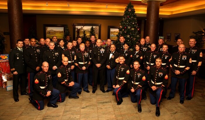 Marines, sailors and spouses from the Combat Center, Marine Corps Base Camp Pendleton and Marine Corps Air Station Miramar joined Professional Golfers’ Association West club members for dinner at the PGA West clubhouse in La Quinta, Calif., Dec. 14, 2013. The dinner is an annual event in which the club members invite service members over for a free dinner and a low-cost, weekend stay at their resort in honor of the Toys for Tots program.