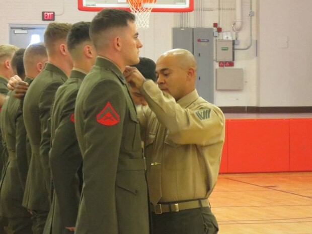 1/2 Marines from 6th Marine Regiment 2nd Marine Division receive their Fourragere. 