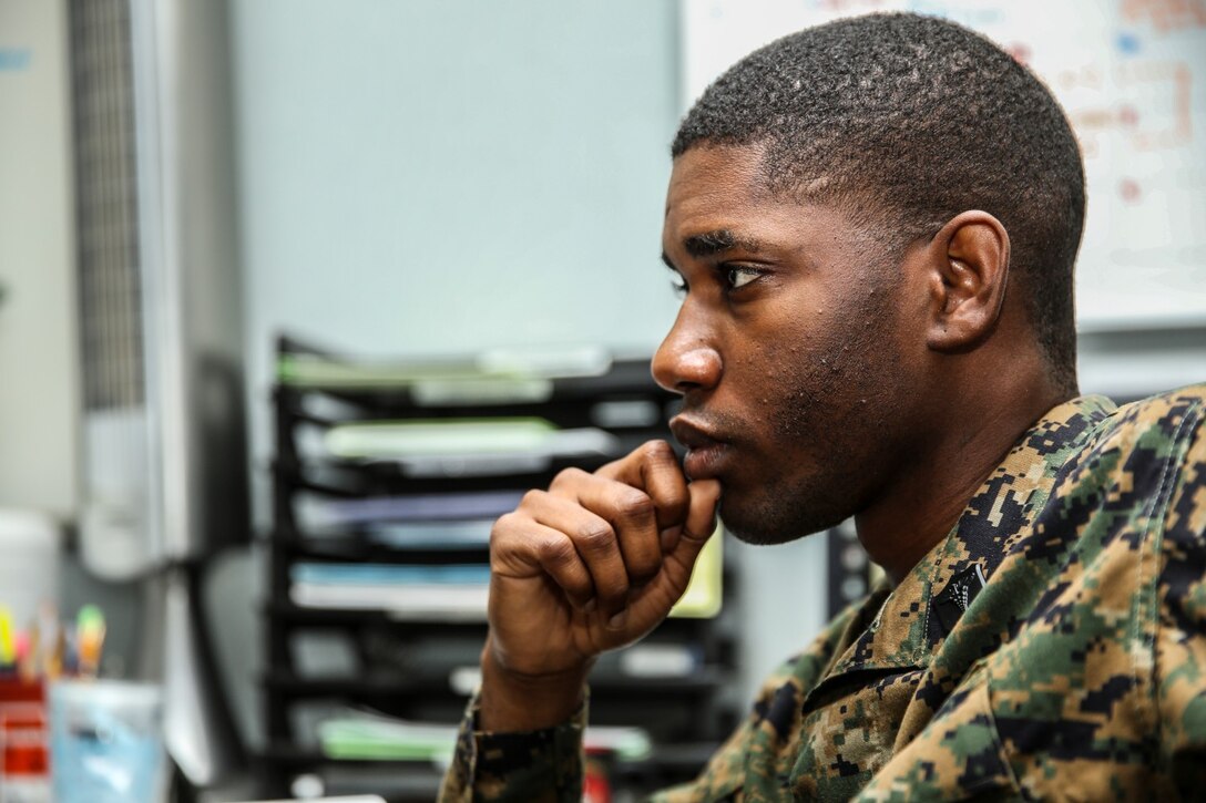 Petty Officer 3rd Class Rylan Burchell, hospital corpsman, talks to Chief Petty Officer Emmanuel Essenete, medical chief, both with the 15th Marine Expeditionary Unit, about career progression aboard Camp Pendleton, Calif., Dec. 19. Burchell is studying for the Enlisted Fleet Marine Force Specialist exam and preparing for his qualification board. Burchell, 25, is from Kingston, Jamaica. (U.S. Marine Corps photo by Cpl. Emmanuel Ramos)