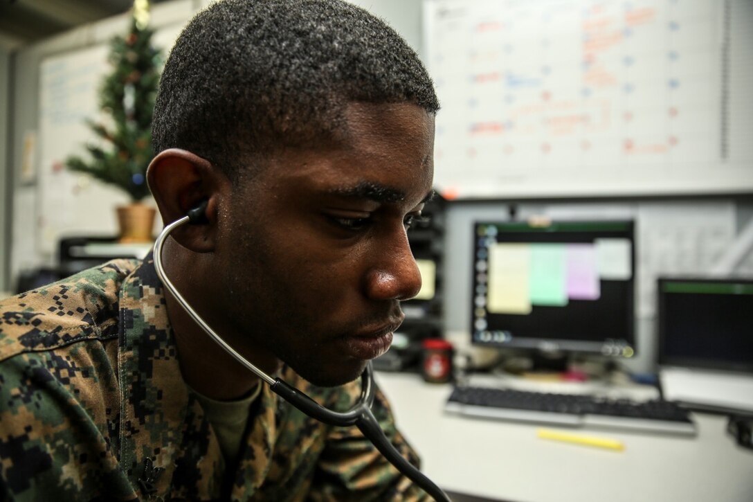 Petty Officer 3rd Class Rylan Burchell, hospital corpsman, 15th Marine Expeditionary Unit, conducts a check up on a patient aboard Camp Pendleton, Calif., Dec. 19. Burchell is studying for the Enlisted Fleet Marine Force Specialist exam and preparing for his qualification board. Burchell, 25, is from Kingston, Jamaica. (U.S. Marine Corps photo by Cpl. Emmanuel Ramos)