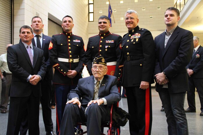 Cpl. Ethan Nagel, his brother Sgt. Anthony Nagel and their grandfather, retired Marine and Korean War veteran, Richard Allen, pose for a photo alongside Brigadier General James S. Hartsell, commanding general of the 4th Marine Division and the Special Forces soldiers who fought alongside Cpl. Nagel in Afghanistan, during Nagel's Silver Star award ceremony.