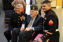 Cpl. Ethan Nagel, a Prior Lake, Minn. native, poses for a photo with his grandfather, retired Marine and Korean War veteran Richard Allen, and Brigadier General James S. Hartsell, commanding general of the 4th Marine Division, during Nagel's award ceremony after having recieved the Silver Star, Dec. 17.