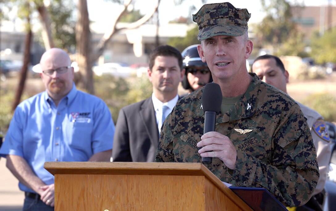 Col. John Farnam, Marine Corps Air Station Miramar, Calif., commanding officer, speaks to media about motorcycle safety training aboard MCAS Miramar, Nov. 5. The air station, 3rd Marine Aircraft Wing, California Highway Patrol, San Diego Police Department and the Motorcycle Safety Foundation teamed up to spread the word about a new motorcycle safety grant which allows the highway patrol to fund a series of yearlong outreach programs throughout California and 60 motorcycle and road sharing presentations to raise awareness about motorcycle safety for riders and drivers.