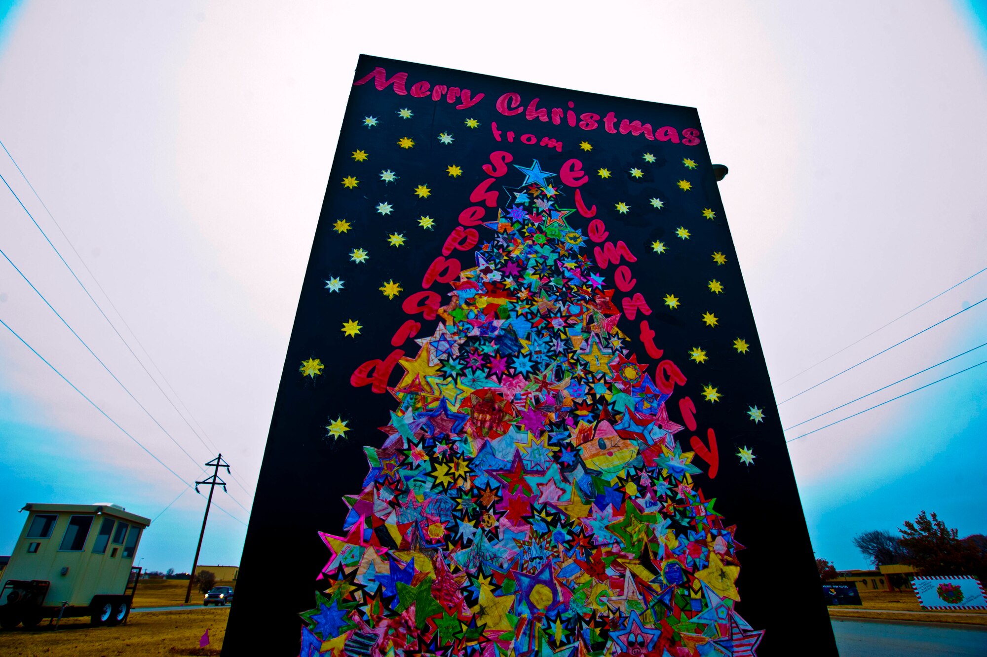 Sheppard Elementary was congratulated on winning a Christmas card competition Dec. 20, while the 82nd Dental Squadron won second place. Each contestant was evaluated on creativity and originality. Cards were made on sheets of plywood and placed near the main gate to greet onlookers. (U.S. Air Force photo by Airman 1st Class Jelani Gibson) 