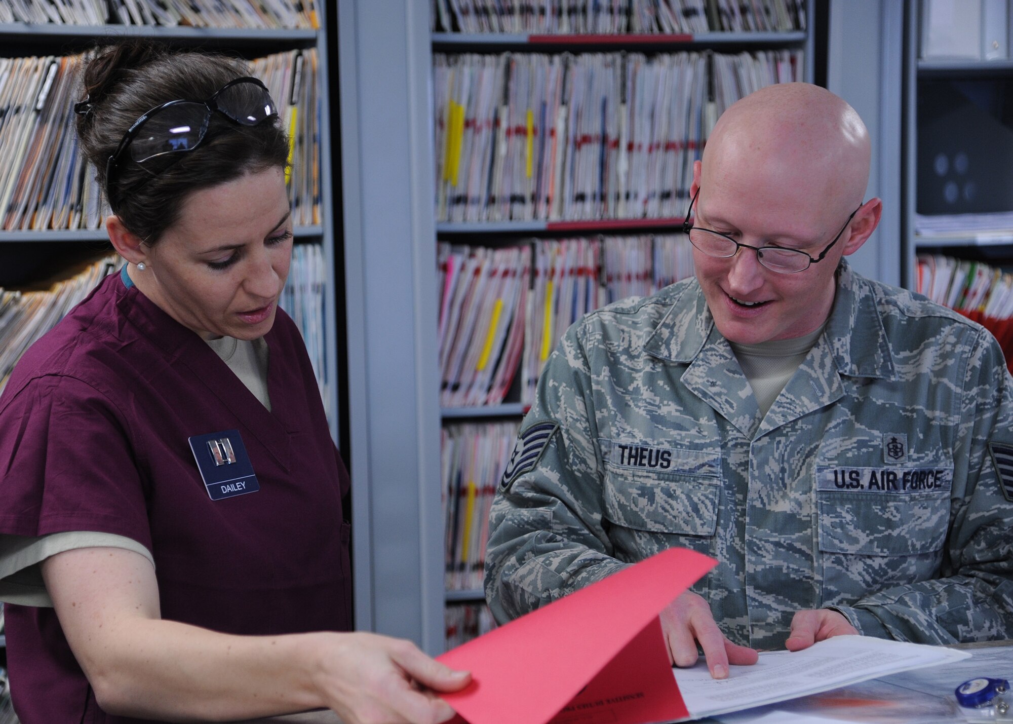Capt. Amber Dailey, 341st Medical Group general dentist (left), and Tech. Sgt. Brian Theus, 341st Medical Operations Squadron clinical element NCO in charge, look over a recent patient’s dental record together.  Malmstrom’s Dental Clinic is responsible for maintaining the oral health of all active-duty Airmen on base as well as some Montana Air National Guardsmen.  (U.S. Air Force photo/Senior Airman Cortney Paxton)