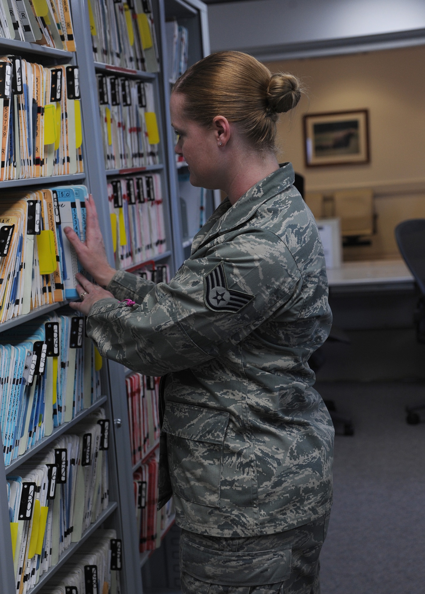Staff Sgt. Jessica Chobot, 341st Medical Operations Squadron Dental Clinic records and reception NCO in charge, puts away dental records at the clinic Dec. 4. Chobot is one of more than 20 Airmen who make up Malmstrom’s Dental Clinic – a smaller clinic than most in the Air Force.  (U.S. Air Force photo/Senior Airman Cortney Paxton)