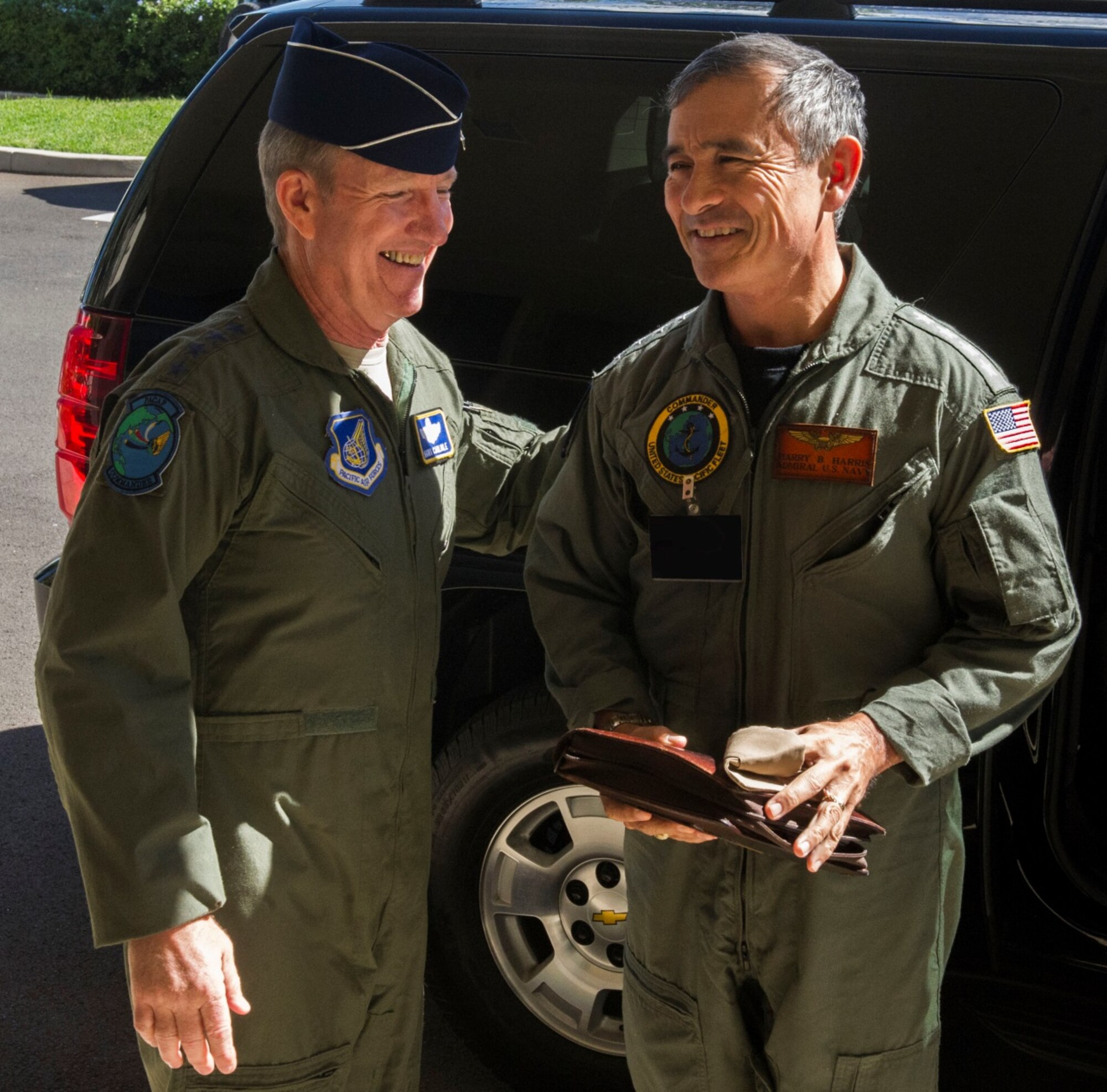 General Hawk Carlisle, Pacific Air Forces commander, greets Admiral Harry Harris, U.S. Pacific Fleet commander, during Harris's visit to PACAF headquarters for PACAF/PACFLEET staff talks Dec. 17, 2013, at Joint Base Pearl Harbor-Hickam, Hawaii. More than 75 personnel from PACAF, PACFLEET, and other agencies discussed many issues, including air operations in maritime surface warfare, joint exercise/training opportunities, Pacific resiliency, staff interoperability, and planning integration. (U.S. Air Force photo/Staff Sgt. Nathan Allen)