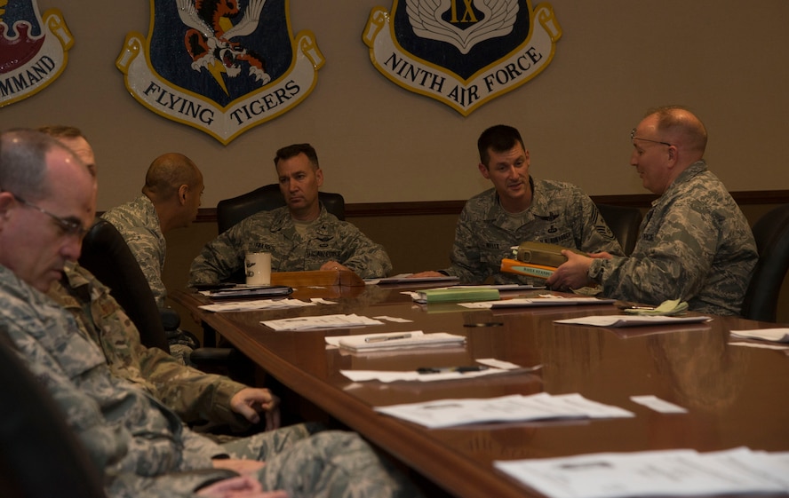U.S. Air Force Col. Chad Franks, 23d Wing commander, prepares for Air Combat Command conference call at Moody Air Force Base, Ga., Dec. 19, 2013. Franks asked each Airman to bring back the discussed information to their squadrons to strengthen risk management and alleviate incidents. (U.S. Air Force photo by Airman Dillian Bamman/Released)
