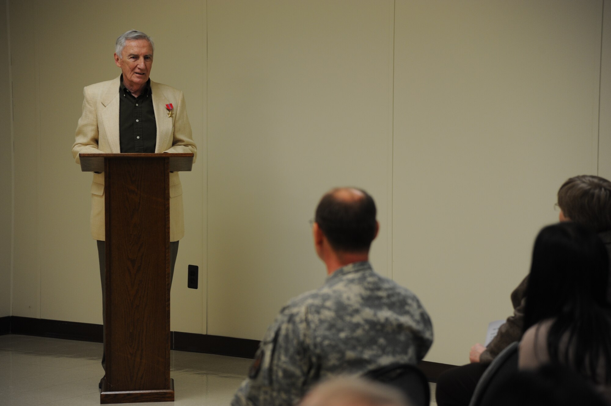 John F. Flynn, World War II-era Army sergeant, reflects on his actions which earned the Bronze Star medal Dec. 17, 2013, in the U.S. Army Reserve Mobilization Museum at Joint Base McGuire-Dix-Lakehurst, N.J. Flynn, a Philadelphia native who currently resides in Egg Harbor, N.J., said the award allowed him to relive the sense of camaraderie he experienced while serving. (U.S. Air Force photo by Airman 1st Class Sean M. Crowe/Released)