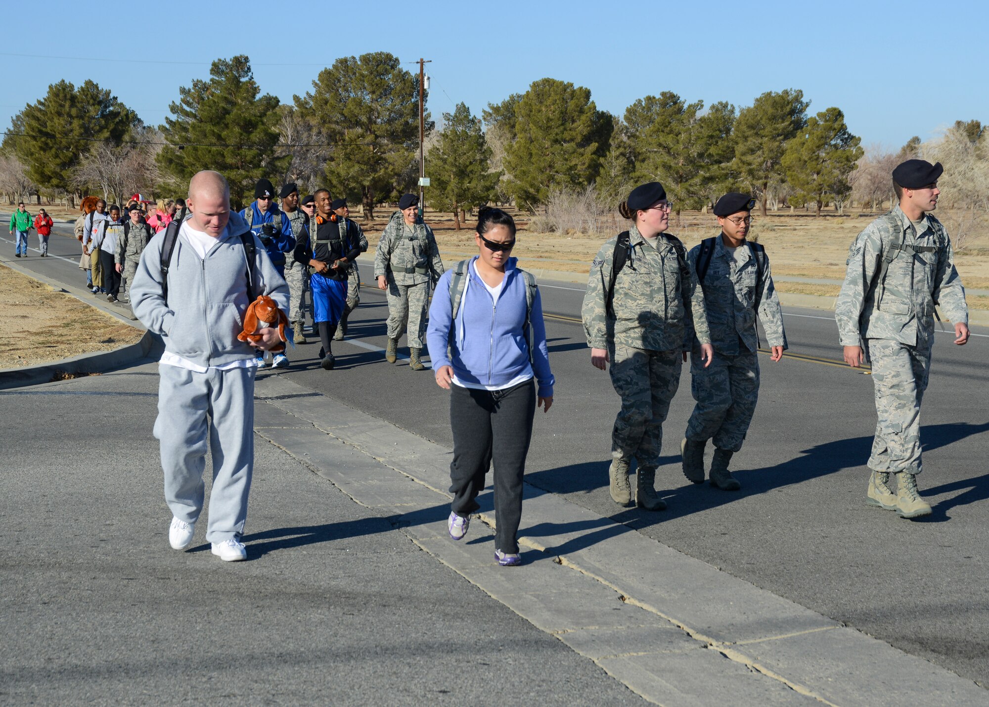 The 412th Security Forces Squadron Training Section held a Ruck March and Toy Drive Dec. 20 for children at the A. Miriam Jamison Children’s Center in Kern County, Calif. Participants carried their donations down a route for 3.5 miles, beginning and ending at the Center of Excellence. (U.S. Air Force photo by Rebecca Amber)