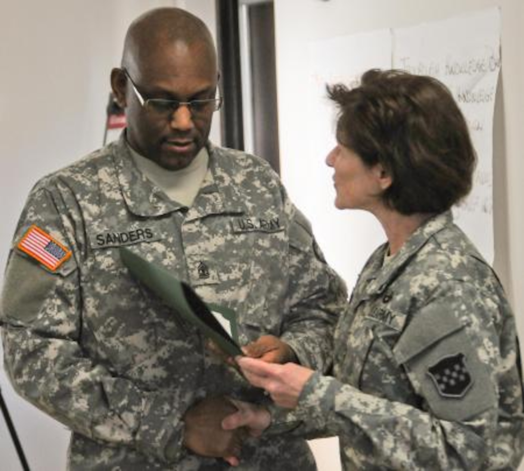 Maj. Gen. Margaret W. Boor, commanding general of the Army Reserve’s 99th Regional Support Command, presents a certificate to 1st Sgt. Trevor Sanders, 78th Army Band, during a Victim Advocate course graduation Dec. 13 at Joint Base McGuire-Dix-Lakehurst, N.J. The course is part of the 99th RSC’s Sexual Harassment/Assault Response and Prevention program (SHARP) and is part of the Chief, Army Reserve’s Ready and Resilient Campaign, which supports the Army Reserve’s commitment to eradicating sexual harassment and sexual assault in its ranks. (U.S. Army photo/Staff Sgt. Shawn Morris)