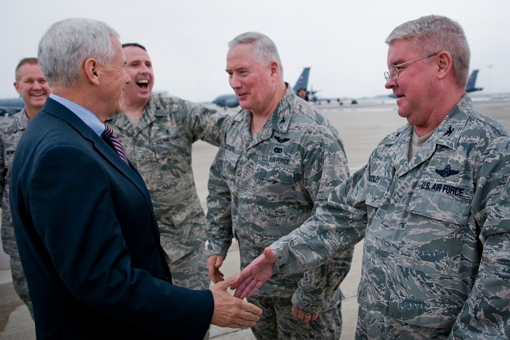 Col. Don Buckley, 434th Air Refueling Wing command, shakes hands and shares a laugh with Indiana Gov. Mike Pence as the governor prepared to conclude a his visit at Grissom Air Reserve Base, Ind., Dec. 19, 2013. Pictured in back, from the left, are Chief Master Sgt. Michael L. Bowden Jr., 434th ARW command chief; Col. Thomas Collins, 434th Aerospace Medicine Squadron commander; and Col. William Stephens, 434th Mission Support Group commander. (U.S. Air Force photo/Tech. Sgt. Mark R. W. Orders-Woempner)
