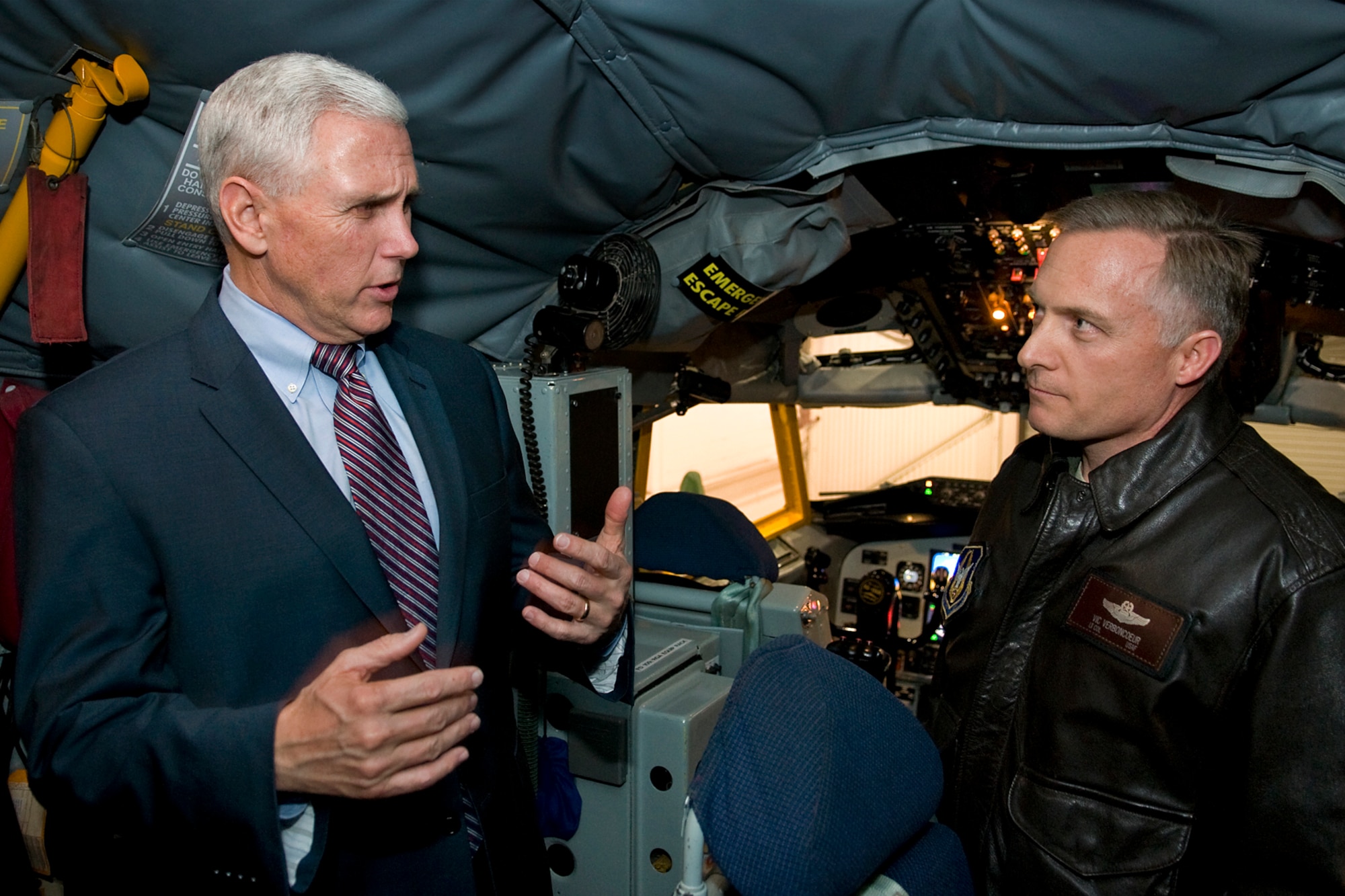 Indiana Gov. Mike Pence asks Lt. Col. Vic Verboncoeur, 72nd Air Refueling Squadron chief pilot, a question about aerial refueling during the governor's visit to Grissom Air Reserve Base, Ind., Dec. 19, 2013. Pence visited the Hoosier base to meet with troops and thank them for their service during the holiday season. (U.S. Air Force photo/Tech. Sgt. Mark R. W. Orders-Woempner)
