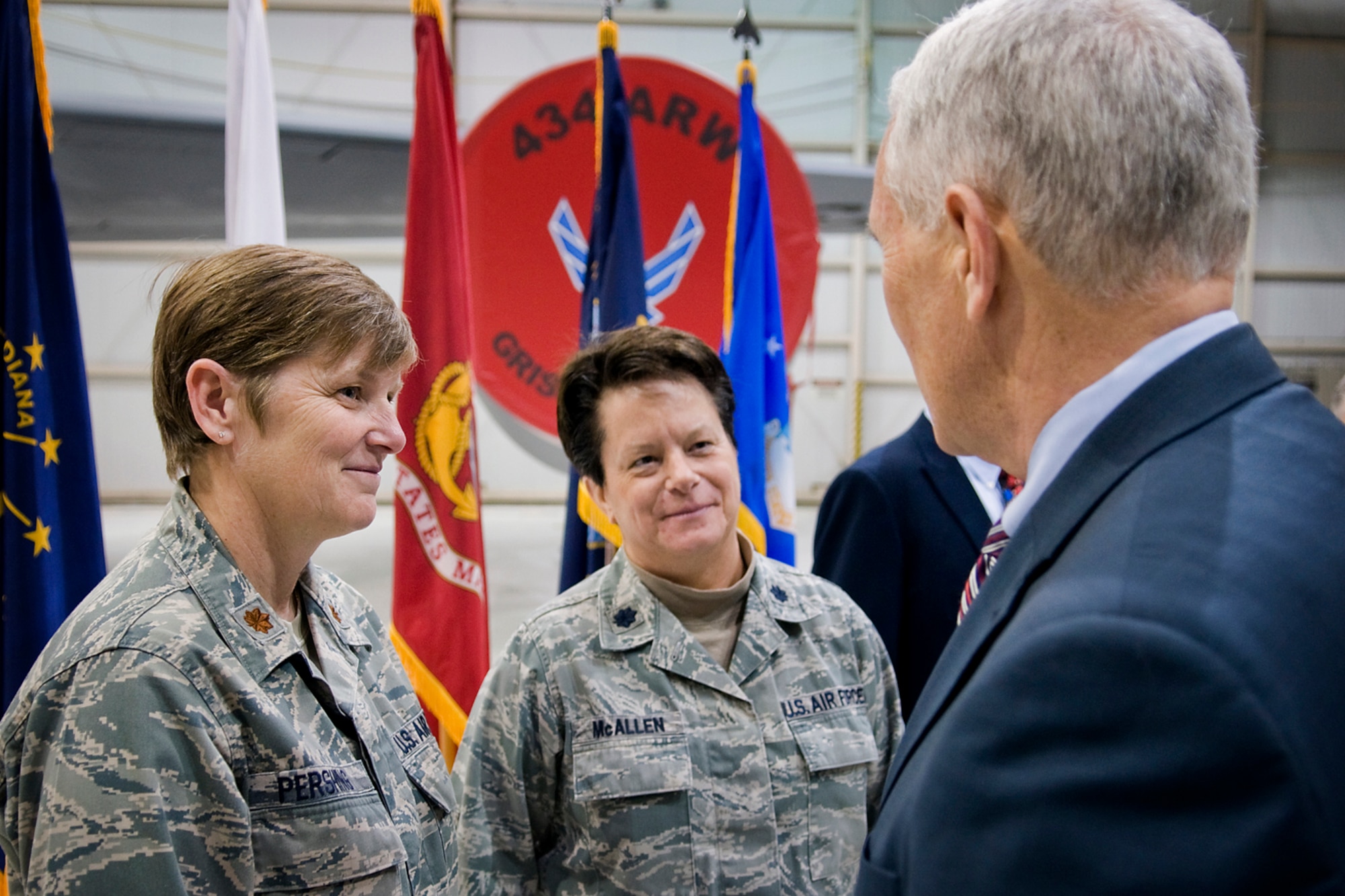 From left, Maj. Tenna Pershing, 434th Operations Support Squadron intelligence officer, and Lt. Col. Maureen McAllen, 434th Mission Support Group deputy commander, talk with Indiana Gov. Mike Pence at Grissom Air Reserve Base, Ind., Dec. 19, 2013. Pence visited the Hoosier base to meet with troops and thank them for their service during the holiday season. (U.S. Air Force photo/Tech. Sgt. Mark R. W. Orders-Woempner)
