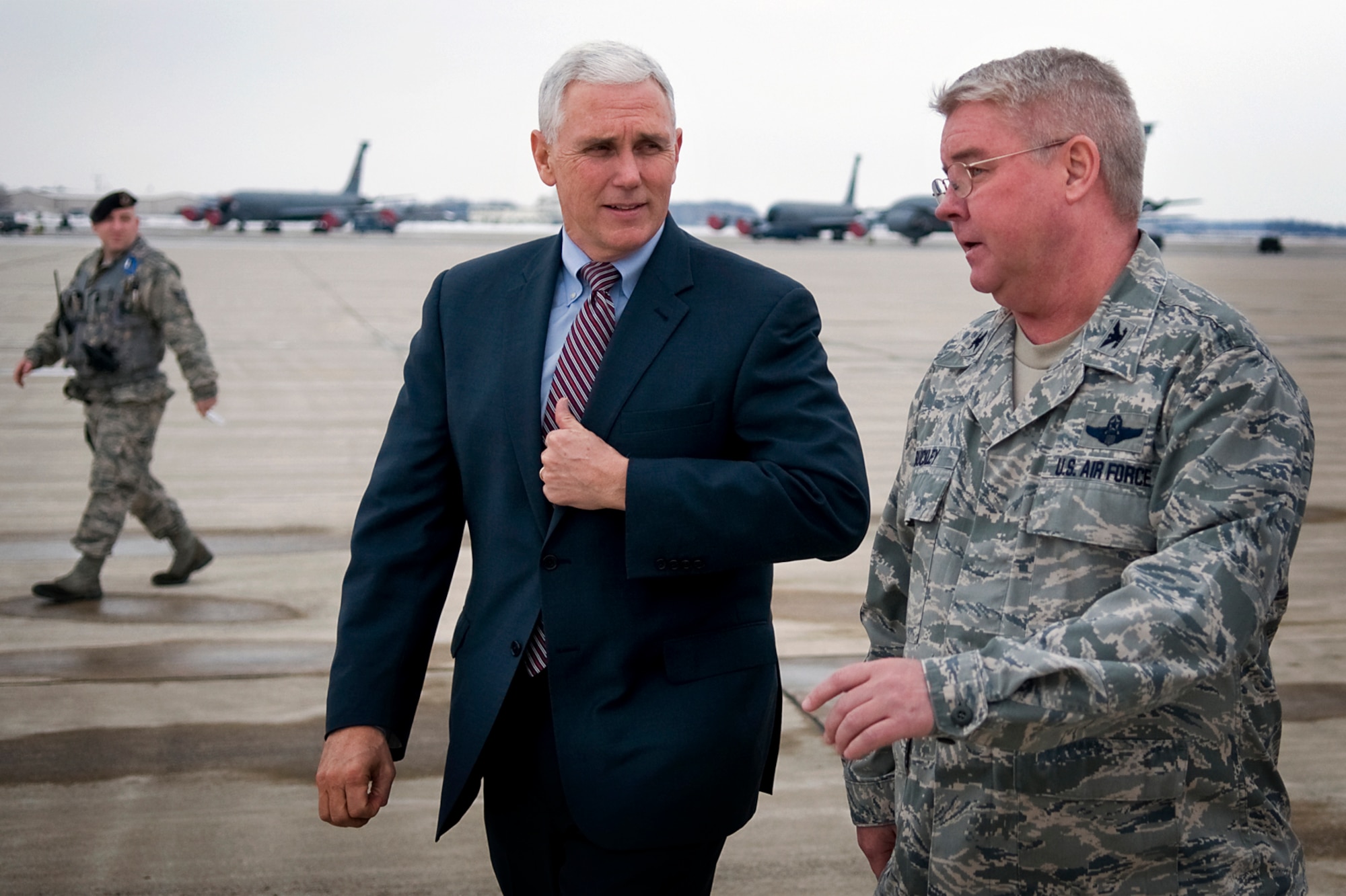 Indiana Gov. Mike Pence talks with Col. Don Buckley, 434th Air Refueling Wing commander, as they make their way to an aircraft hangar at Grissom Air Reserve Base, Ind., Dec. 19, 2013. During Pence's visit to the Hoosier base, he  shook hands with nearly every one of the approximately 100 Grissom employees in attendance before taking part in a tour of a 434th Air Refueling Wing KC-135. (U.S. Air Force photo/Tech. Sgt. Mark R. W. Orders-Woempner)
