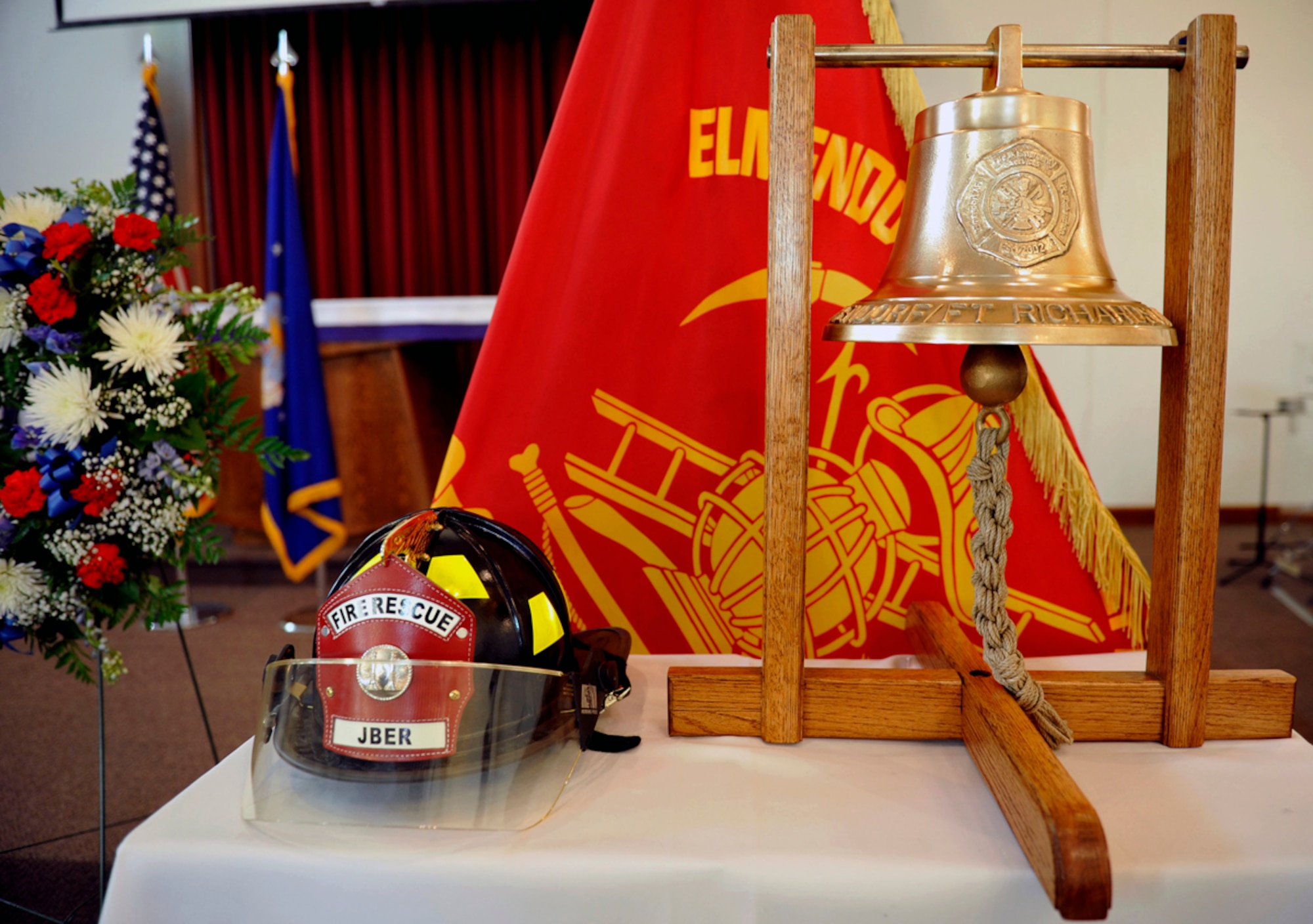 The helmet worn by Air Force Staff Sgt. Tanner Volkers, 673d Civil Engineer Squadron firefighter, is on display during a memorial service on Joint Base Elmendorf-Richardson Dec. 17. Volkers was found dead near an Anchorage trailhead Dec. 10 after a multi-day search by fellow Airmen and the Anchorage Police Department. (U.S. Air Force photo/Airman 1st Class Tammie Ramsouer)