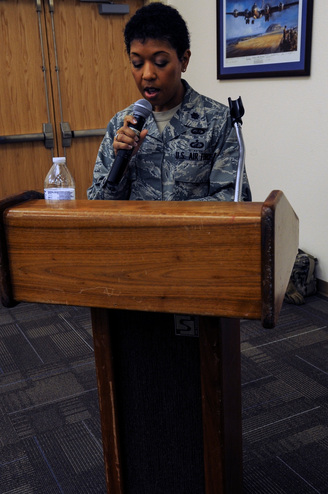 Air Force Lt. Col. Diltrice Thomas, 366th Force Support Squadron commander, addresses enlisted Airmen during a force management town hall meeting at Mountain Home Air Force Base, Idaho, Dec. 20, 2013. Thomas briefed programs like Active Duty Service Commitment Waivers, Time in Grade Waivers, Temporary Early Retirement Authority, Date of Separation Rollbacks, Voluntary Separation Pay, Quality Force Review Boards and Enlisted Retention Boards. (U.S. Air Force photo by Master Sgt. Kevin Wallace/RELEASED)