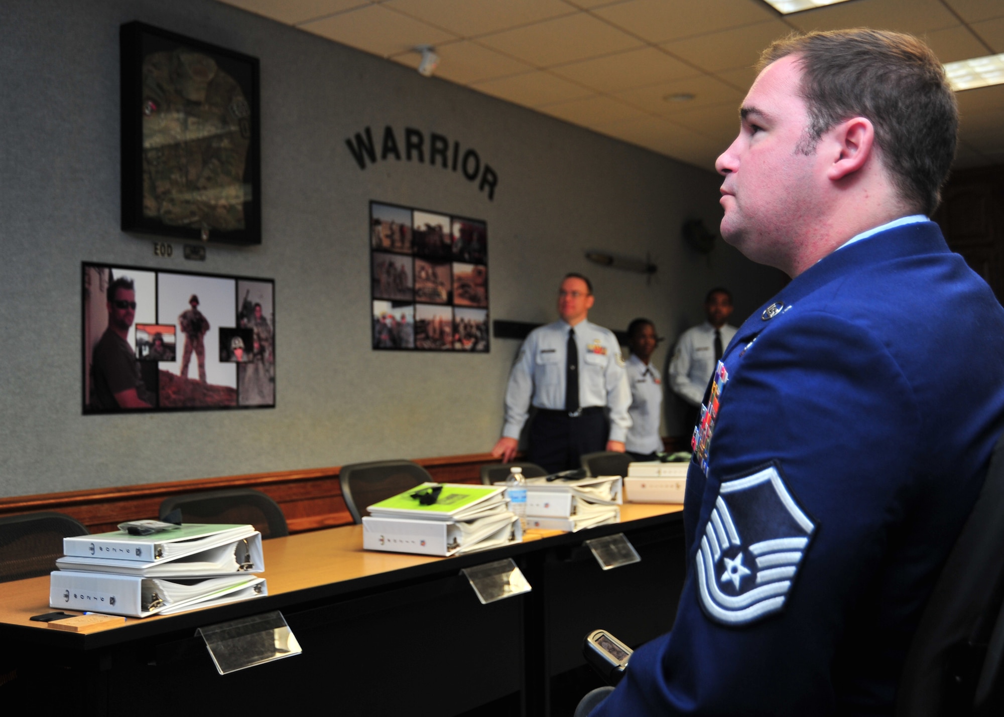 Master Sgt. Joe Deslauriers, 1st Special Operations Civil Engineer Squadron explosive ordnance disposal technician, at Hurlburt Field, Fla., visits the room dedicated to him by the Paul Airey NCO Academy for the first time Dec. 19, at the NCOA. Deslauriers was awarded the Silver Star after losing both his legs and left arm during a 2011 deployment to Afghanistan. (U.S. Air Force photo by Airman 1st Class Sergio A. Gamboa)