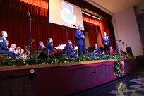 Air Force Brig. Gen. Bob LaBrutta, 502nd Air Base Wing and Joint Base San Antonio commander, welcomes the audience with opening remarks Dec. 17 at the Joint Base San Antonio-Lackland Bob Hope Theater. (U.S. Air Force photo by Airman 1st Class Lincoln Korver)
