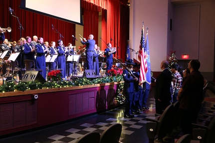 The Air Force Band of the West plays the Star Spangled Banner while military training instructors present the colors Dec. 17 at the Joint Base San Antonio-Lackland Bob Hope Theater. (U.S. Air Force photo by Airman 1st Class Lincoln Korver)