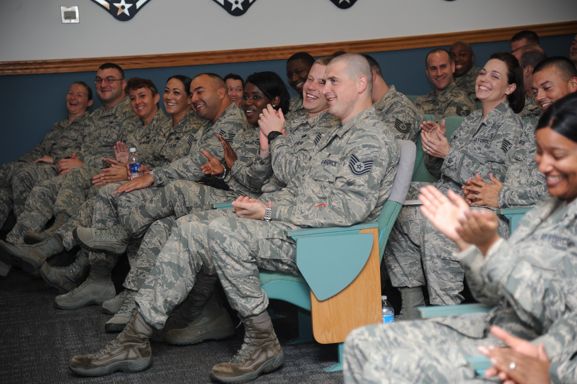 Mathies NCO Academy students laugh at comments made by Retired Chief Master Sgt. Jim Binnicker, the ninth Chief Master Sergeant of the Air Force, as he speaks to them Dec. 19, 2013, at Keesler Air Force Base, Miss.  Binnicker’s one-day visit to Keesler also included speaking at the Keesler Medical Center and to various military groups on base.  (U.S. Air Force photo by Kemberly Groue)